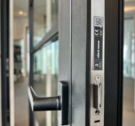 DigiTrace personalised label on black door.